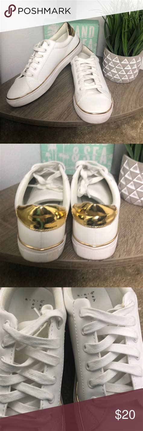 white sneakers with gold accents.